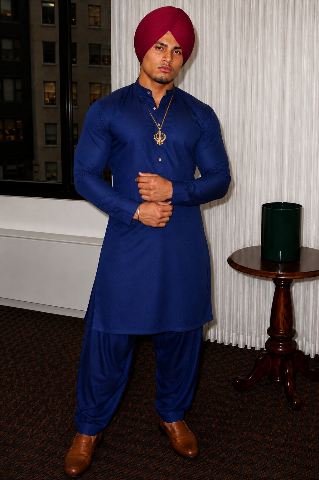 Main character wearing a maroon turban and blue Punjabi attire